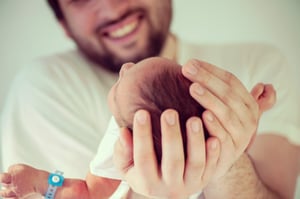 Newborn baby first days with his father
